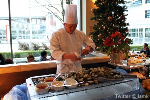 Chef shucking fresh oysters