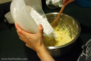 Stir in flour mixture with a wooden spoon Stir in flour mixture with a wooden spoon