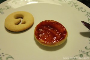 Cookies sandwiching a layer of raspberry jam Cookies sandwiching a layer of raspberry jam