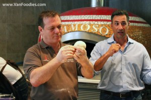 Roberto demonstrates on how to form the dough ball